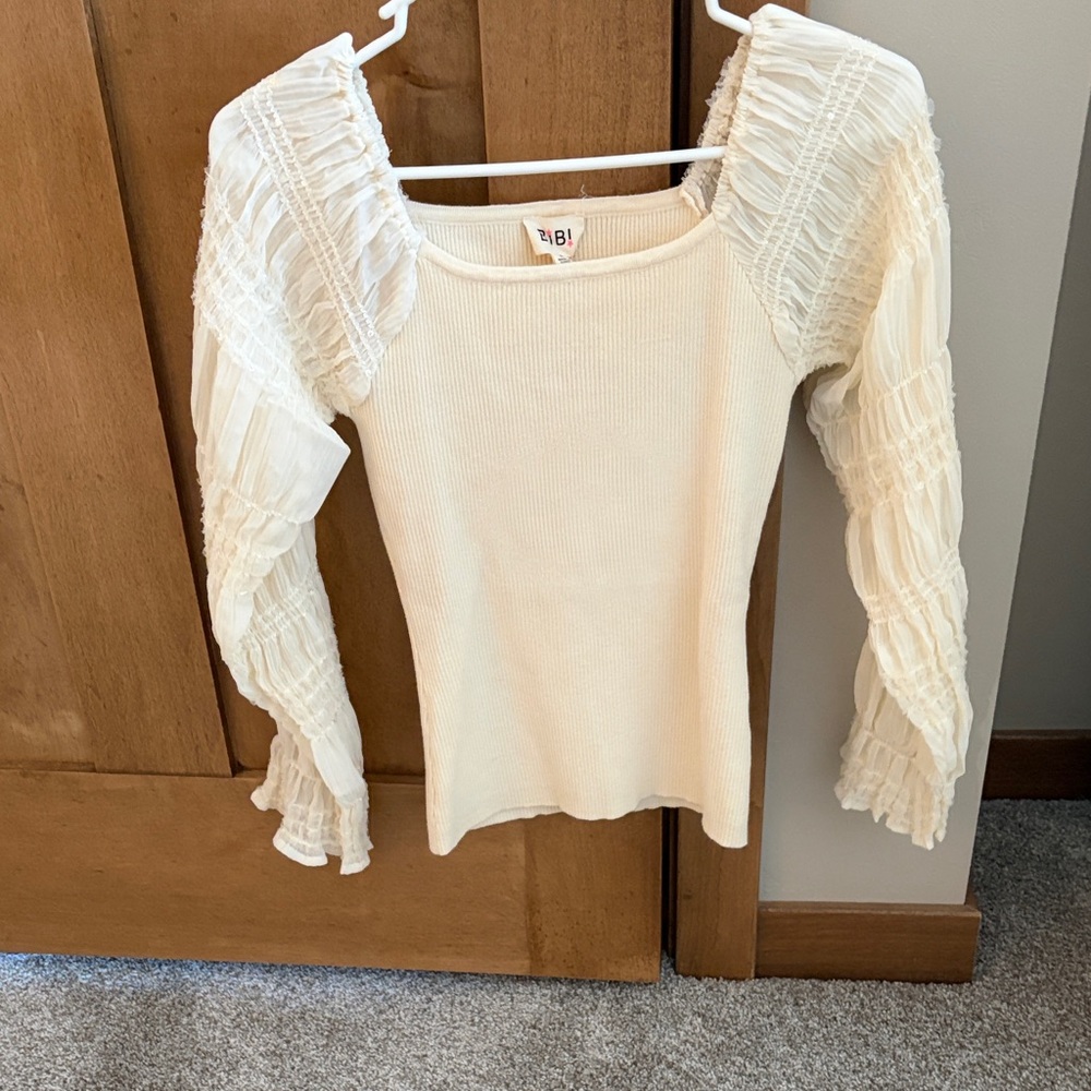 Elegant Cream Women's Top with sheer sequined Ruffled Sleeves